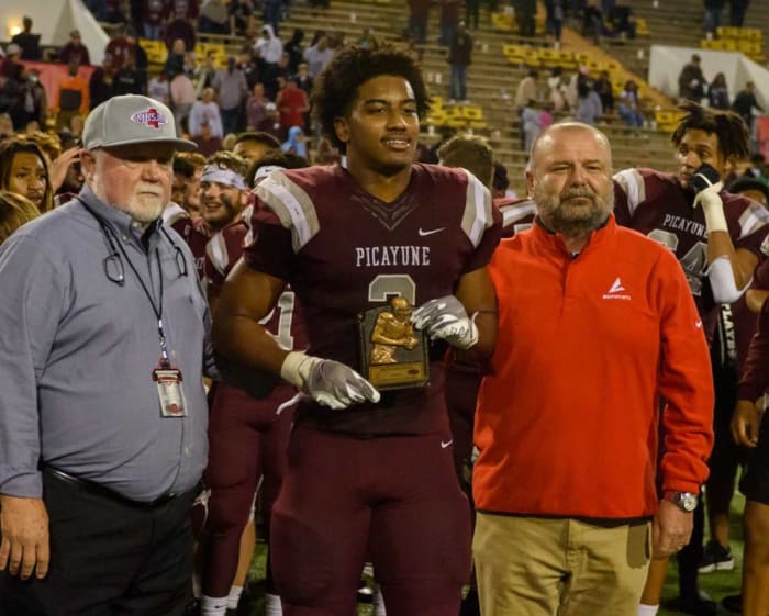 Picayune running back Dante Dowdell (2) poses with the MVP award after winning the MHSAA Class 5A football championship game against West Point.